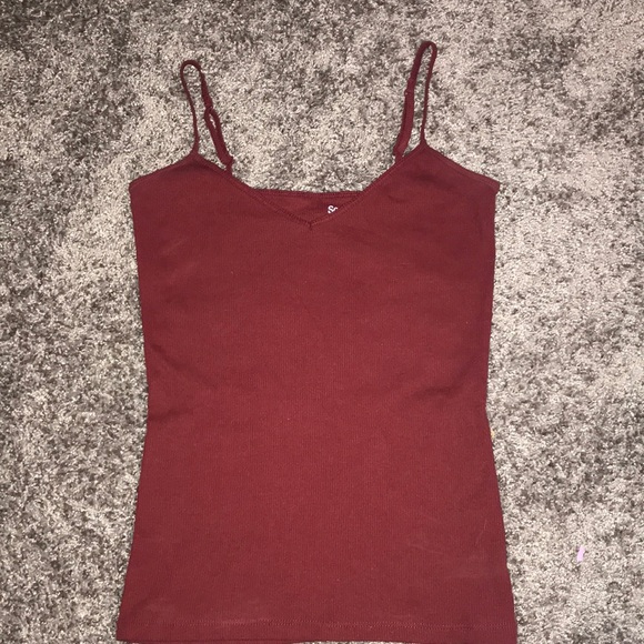 This tank top is a Burgundy/Maroon color it is a size small and the brand is SO. - Picture 1 of 2